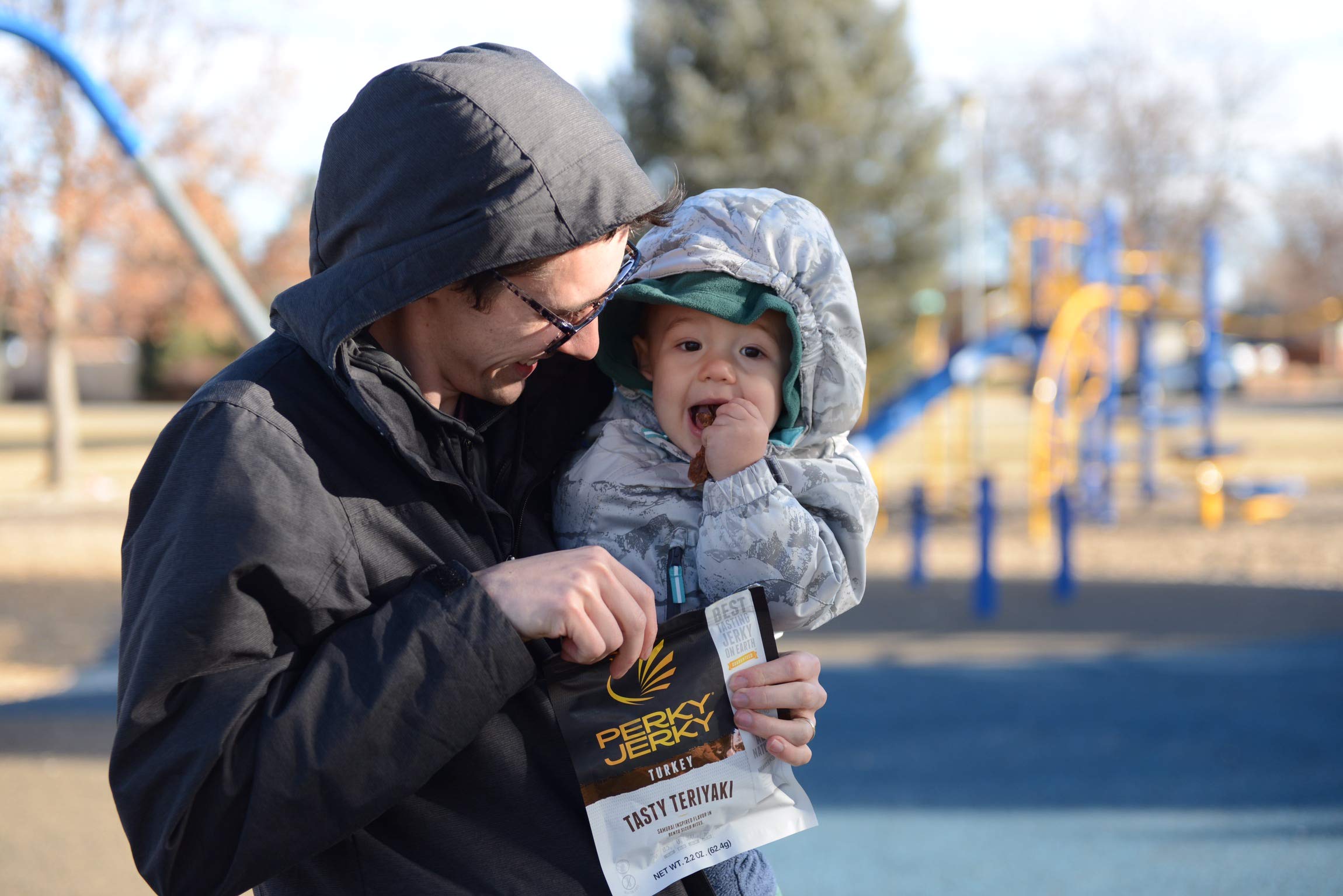 Perky Jerky bag in hand showing compact size and travel-friendly convenience