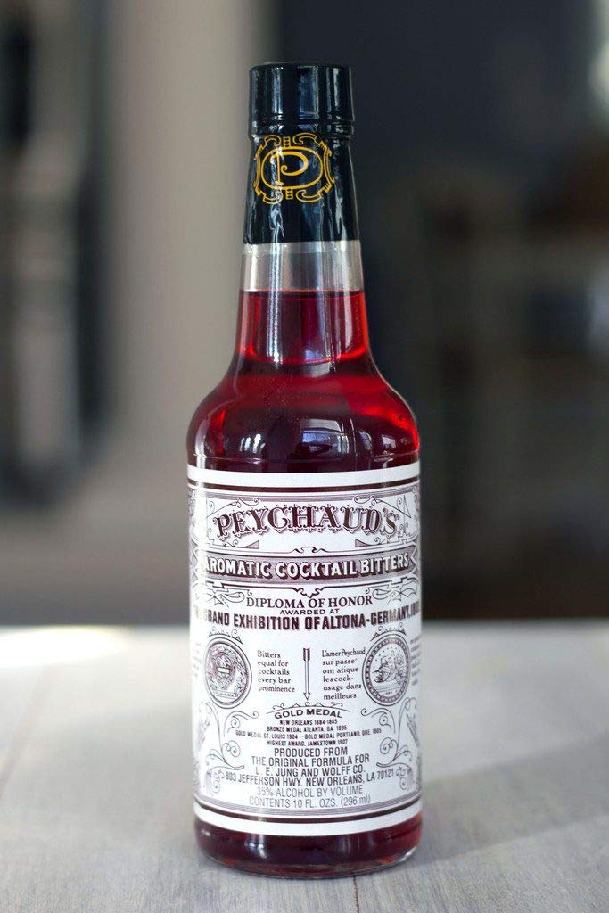Peychaud's liquid close-up highlighting color and aromatic detail benefit