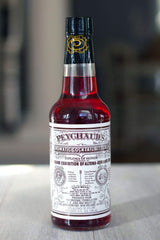 Peychaud's liquid close-up highlighting color and aromatic detail benefit