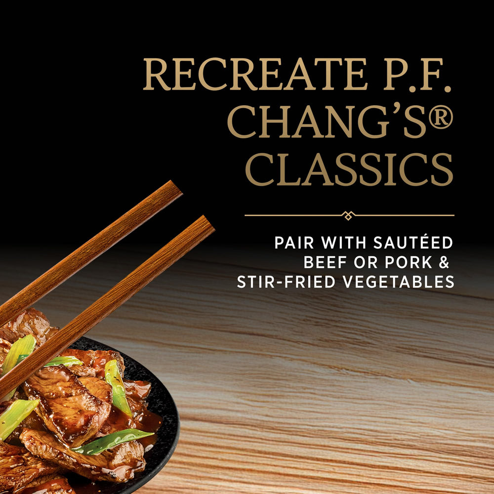 P.F. Chang's bottle next to a measuring cup for size and serving scale reference