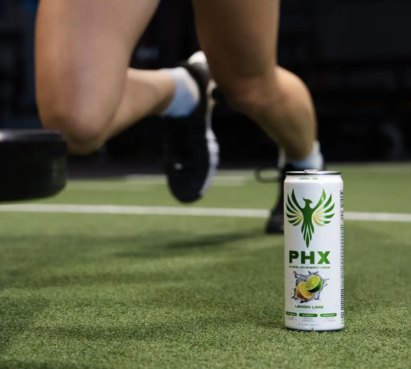 PHX can outdoors on rock showing active lifestyle and on-the-go hydration benefit