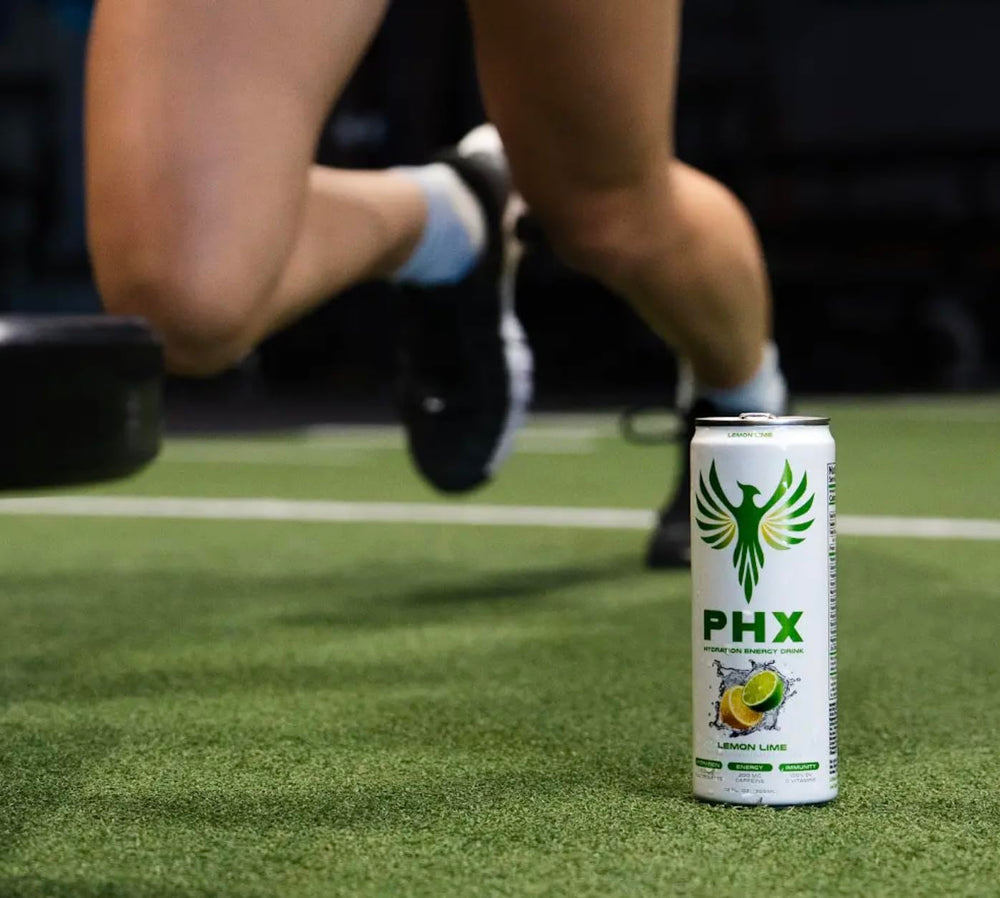 PHX can outdoors on rock showing active lifestyle and on-the-go hydration benefit