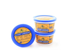 Pine River sharp cheddar tub front view showing label and easy-open lid for convenient snacking