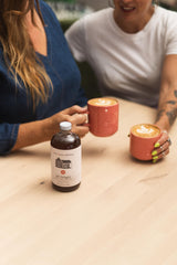 Pink House Alchemy label close-up highlighting ingredients and handcrafted authenticity benefit