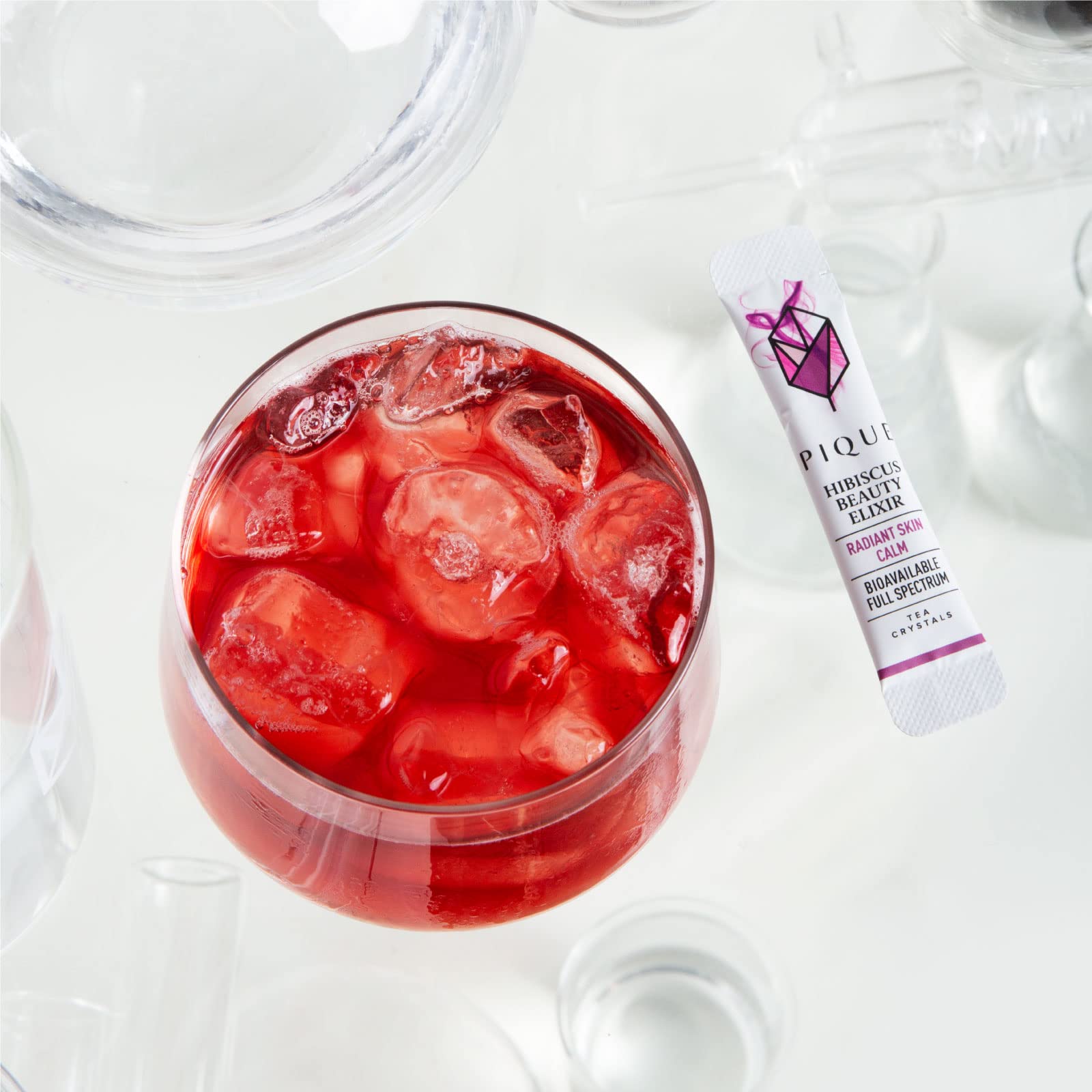 PIQUE iced hibiscus tea in a glass showing refreshing tart flavor benefit