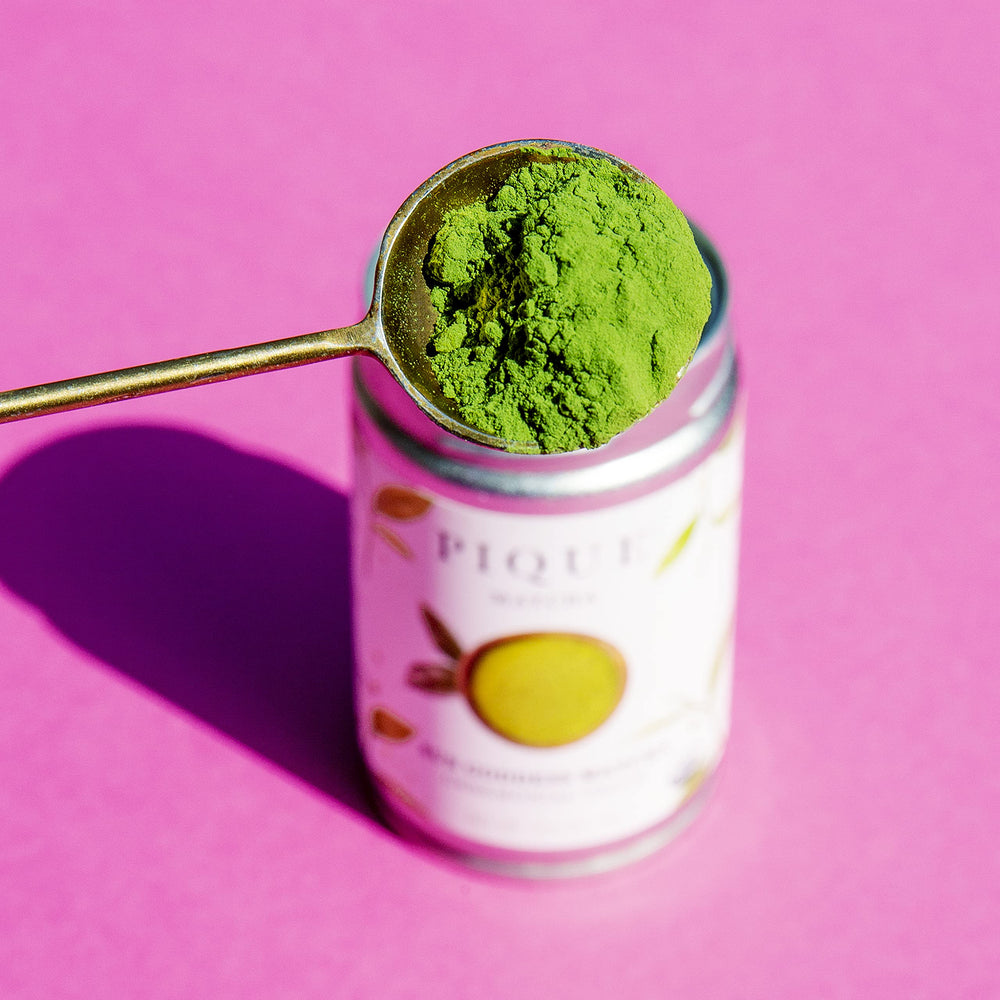 PIQUE teaspoon of matcha beside ruler to show 1/2 teaspoon serving size
