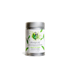 PIQUE Sun Goddess tin front showing premium packaging and organic badge