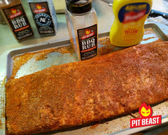 Pit Beast measuring spoon with rub demonstrating easy portioning