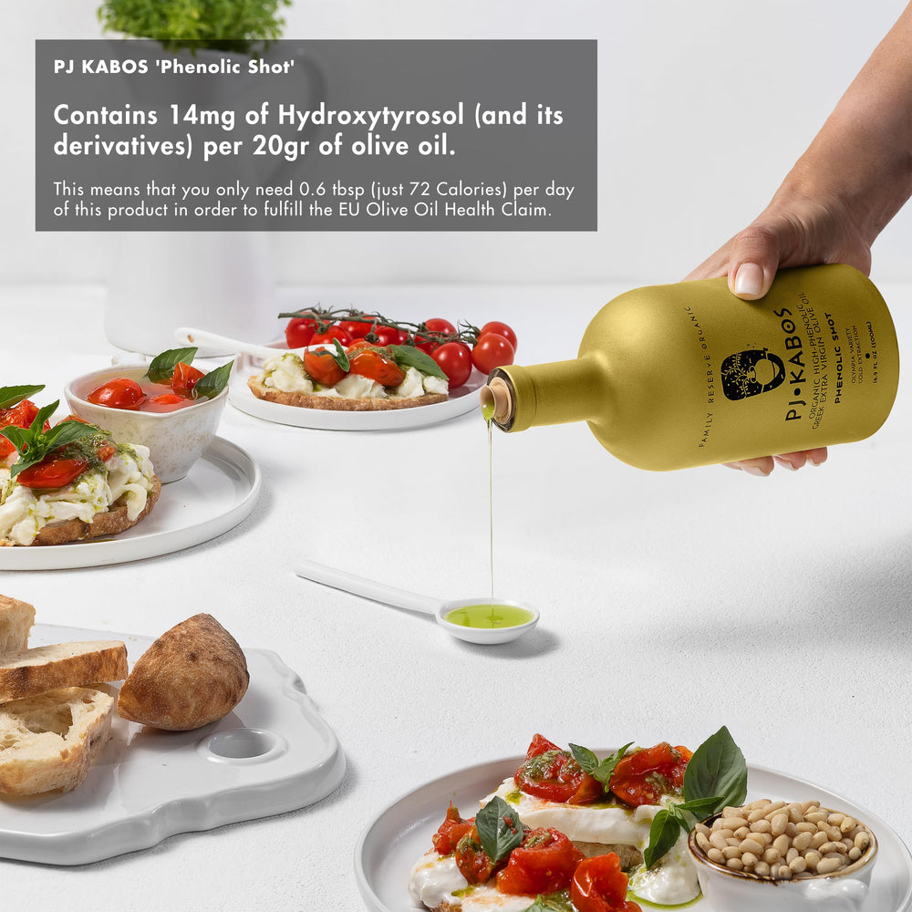 P.J. KABOS bottle in olive grove setting emphasizing origin and fresh harvest