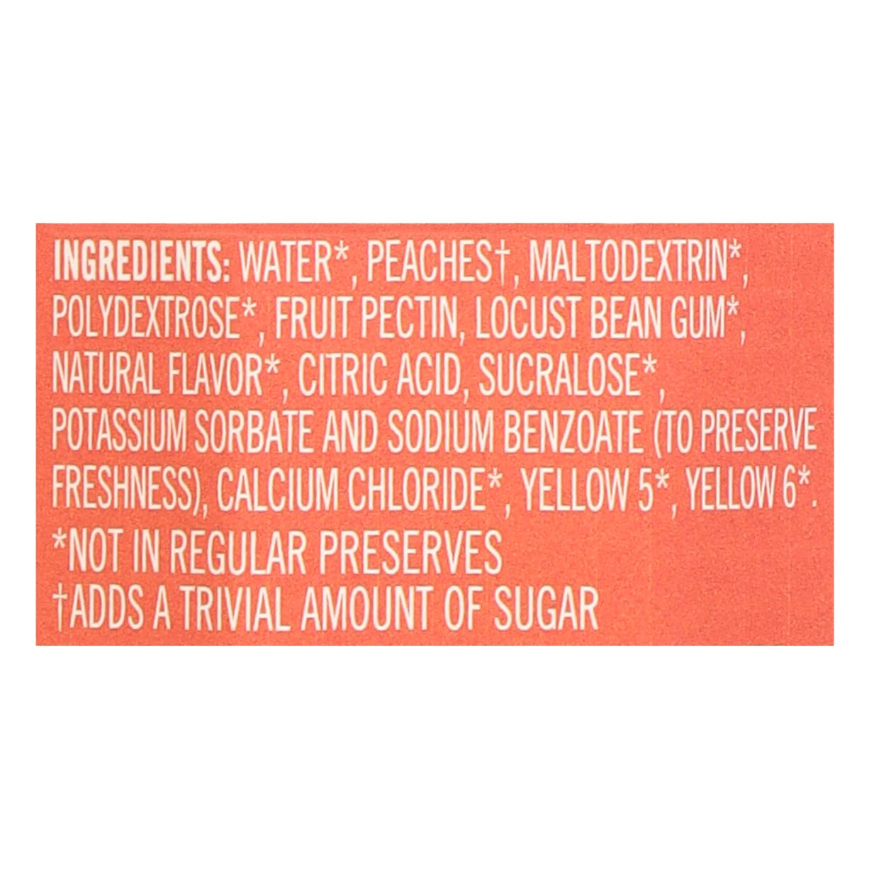 Polaner peach jam jar beside fruit showing jar size and pantry-ready benefit