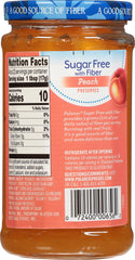Spoon scooping Polaner peach jam showing smooth texture and easy spreading