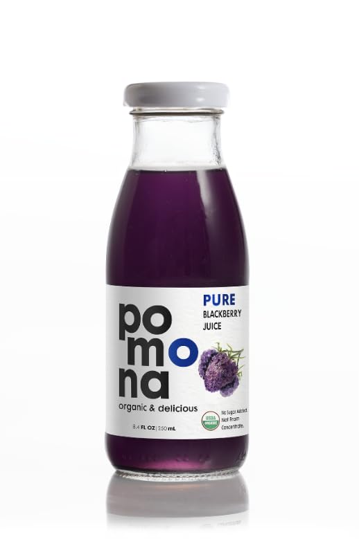 Pomona Organic blackberry juice bottle held in hand showing 8.4 oz size for on-the-go portability