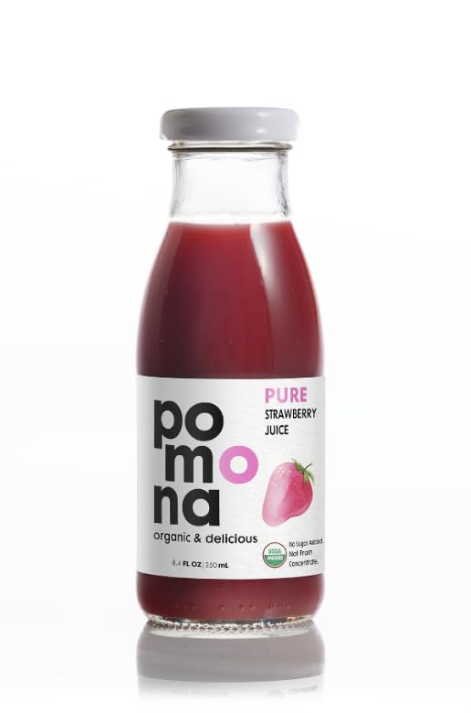 Pomona organic bottle beside a hand and fruit for size comparison showing travel-friendly convenience