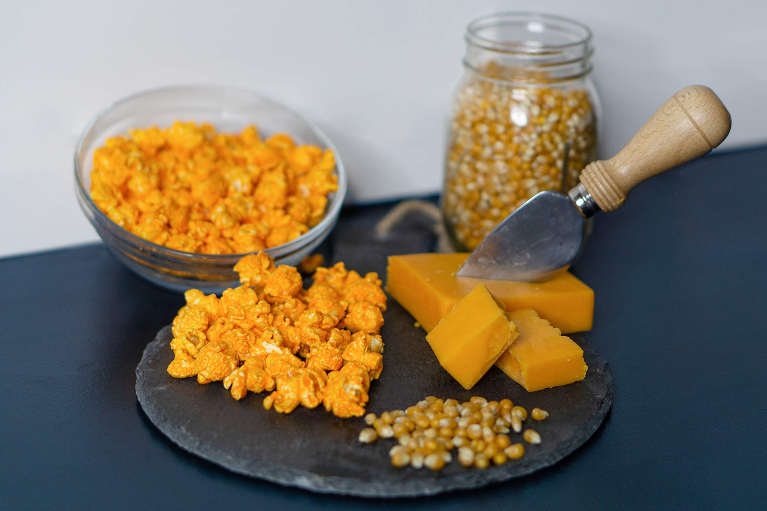 Pop'N Popcorn close-up of cheddar-coated kernel texture, highlights bold flavor