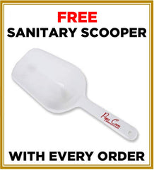 Pops Corn scooper beside tin demonstrating included utensil for easy serving