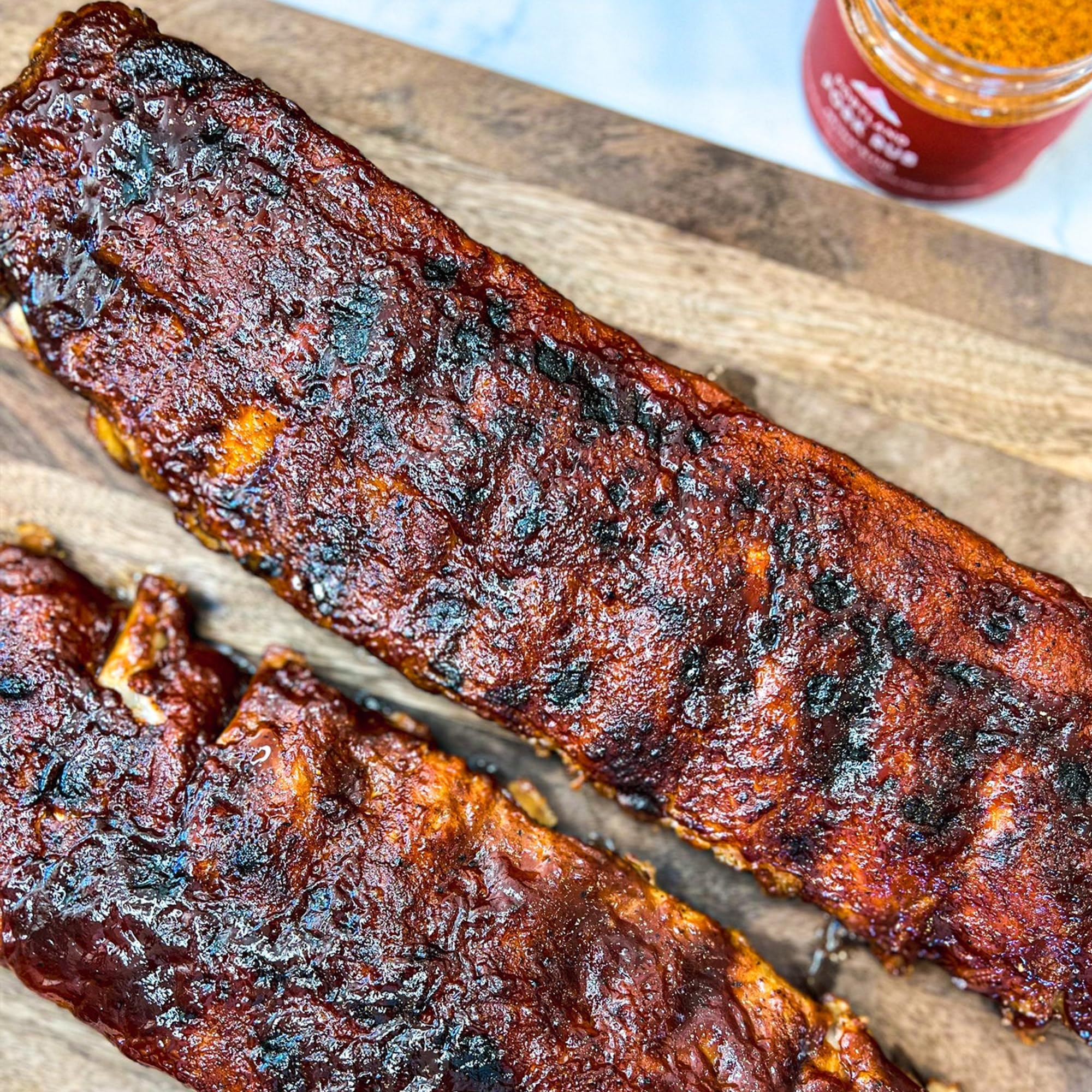 Portland Salt Co jar on a backyard grill table suggesting elevated barbecue meals