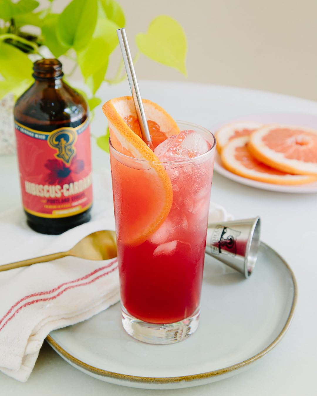 Portland Syrups bottle alongside a crafted cocktail illustrating mixology use