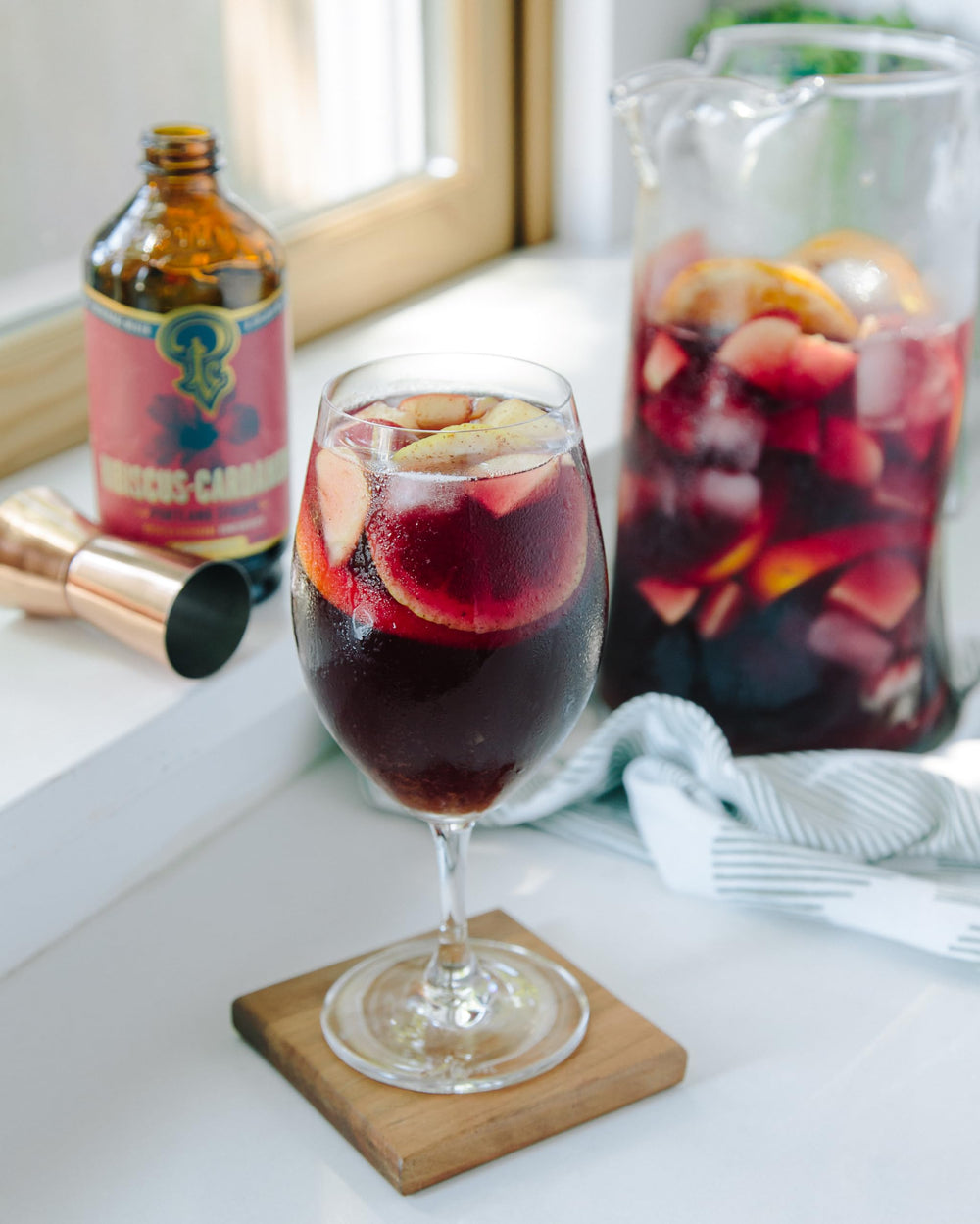 Portland Syrups with hibiscus flowers and cardamom pods displaying whole ingredients