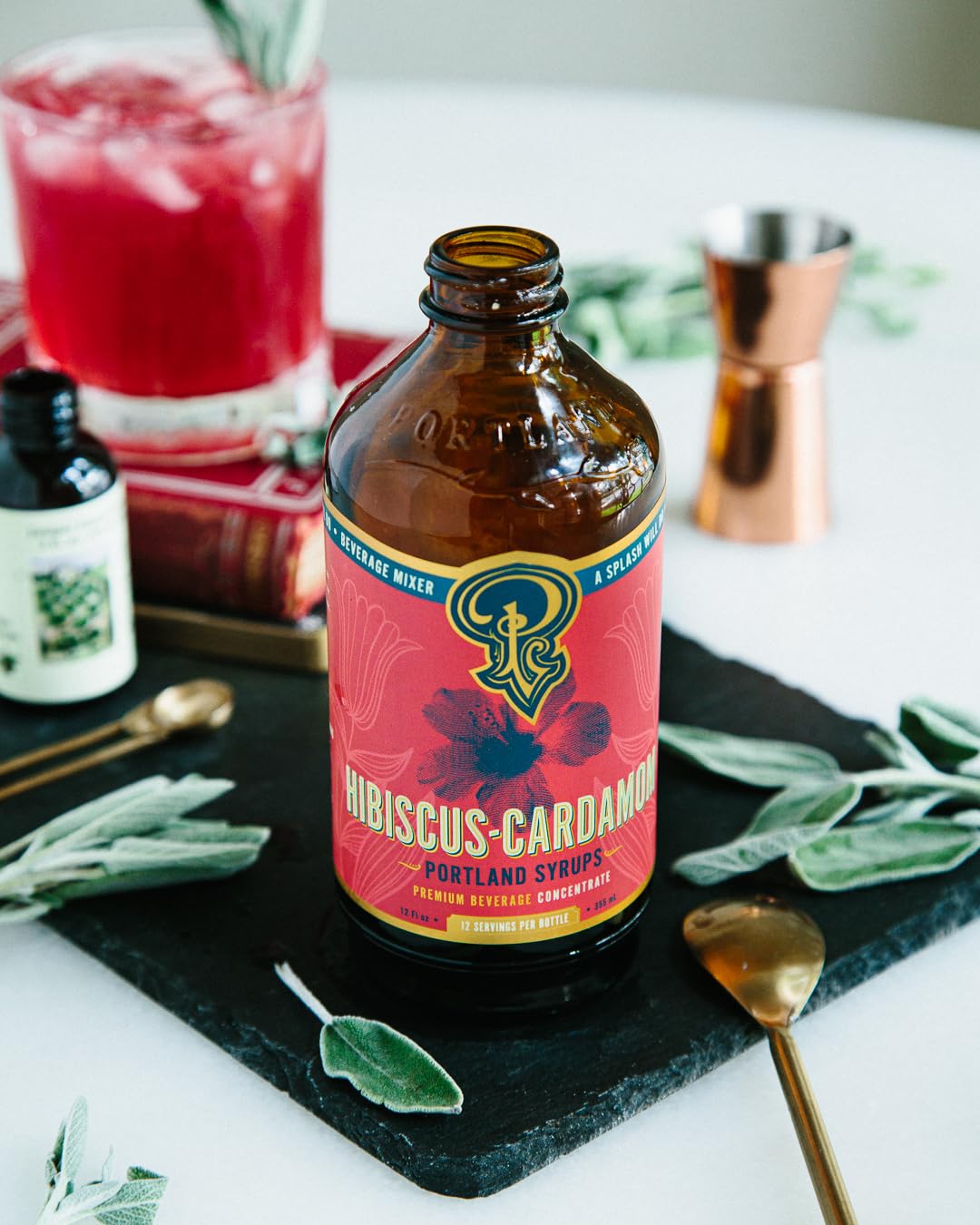 Portland Syrups next to a ruler showing 12 oz bottle size and serving yield