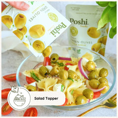 Poshi olives on charcuterie board enhancing appetizers with savory basil-garlic flavor
