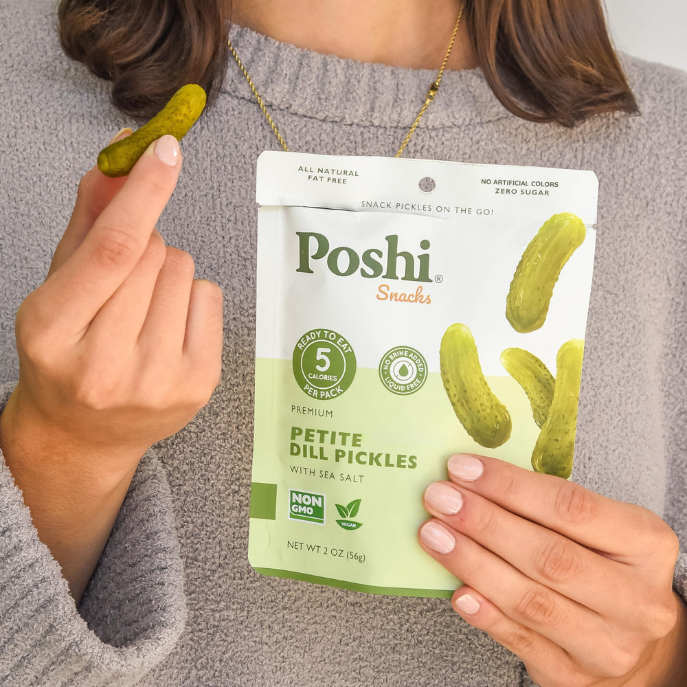 Poshi ten pouches stacked to show pack quantity and easy storage benefit