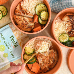 Poshi pouch beside a measuring cup illustrating portion size and calorie-conscious serving