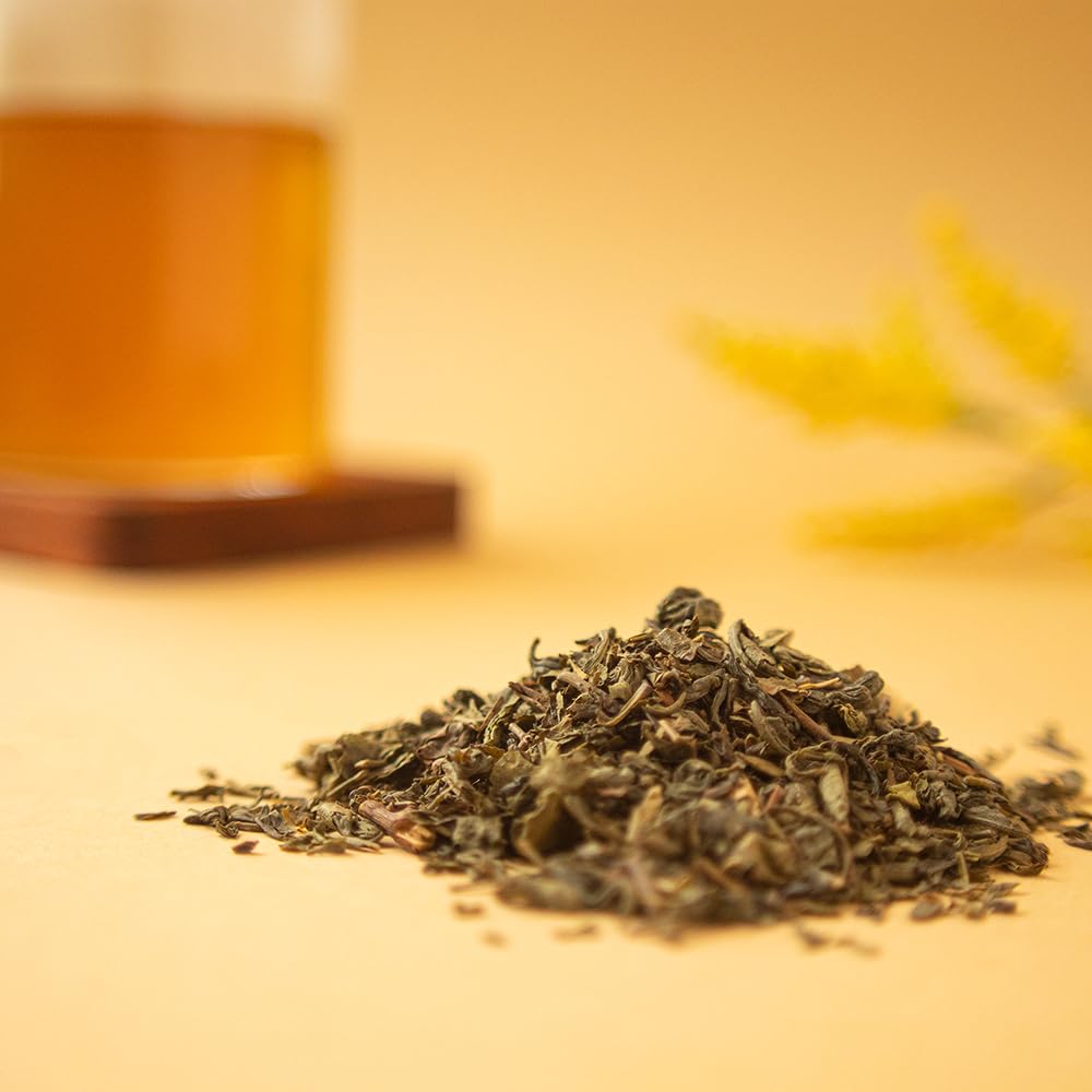 Organic Positively Tea bag held in hand for scale showing one-pound size and value