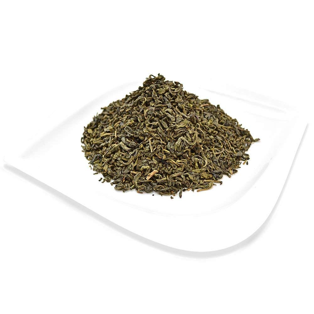 Organic Positively Tea Company refilled tin and scoop demonstrating bulk storage convenience