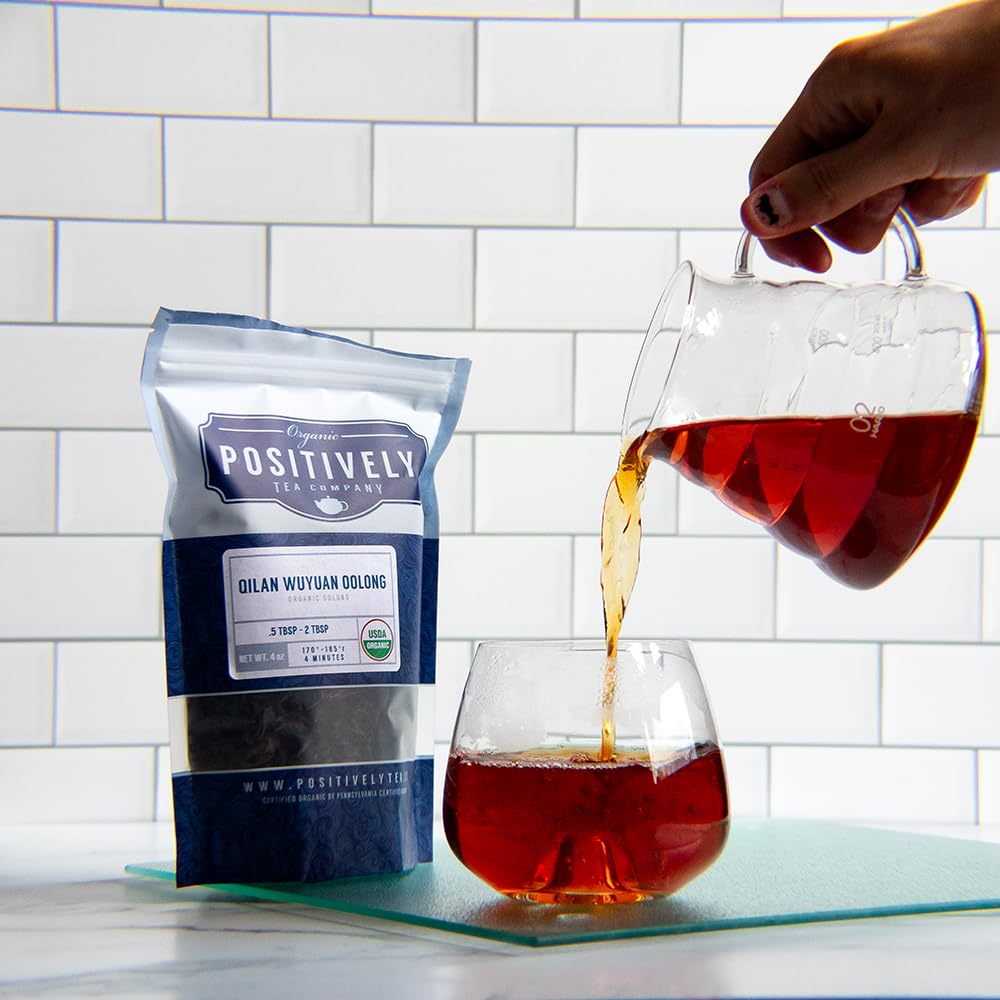 16 oz bag beside a measuring scoop to show size and serving value for Positively Tea