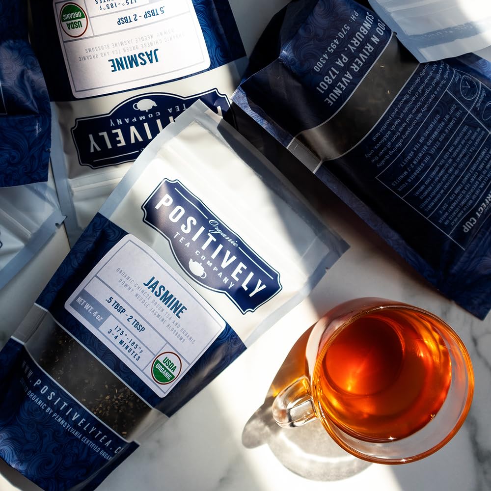 Organic Positively Tea Company 16 ounce next to a ruler showing scale and quantity benefit