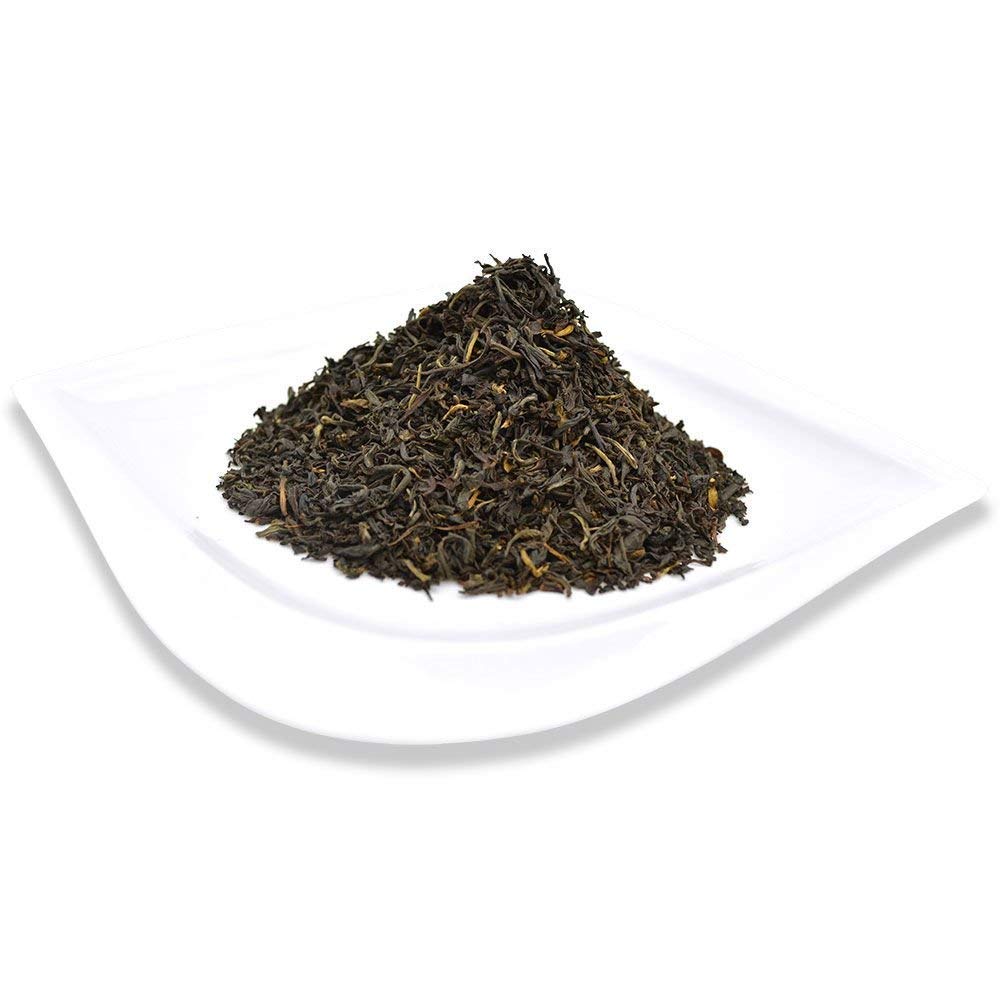 Organic Positively Tea held by hand shows 16oz scale and pantry-ready size