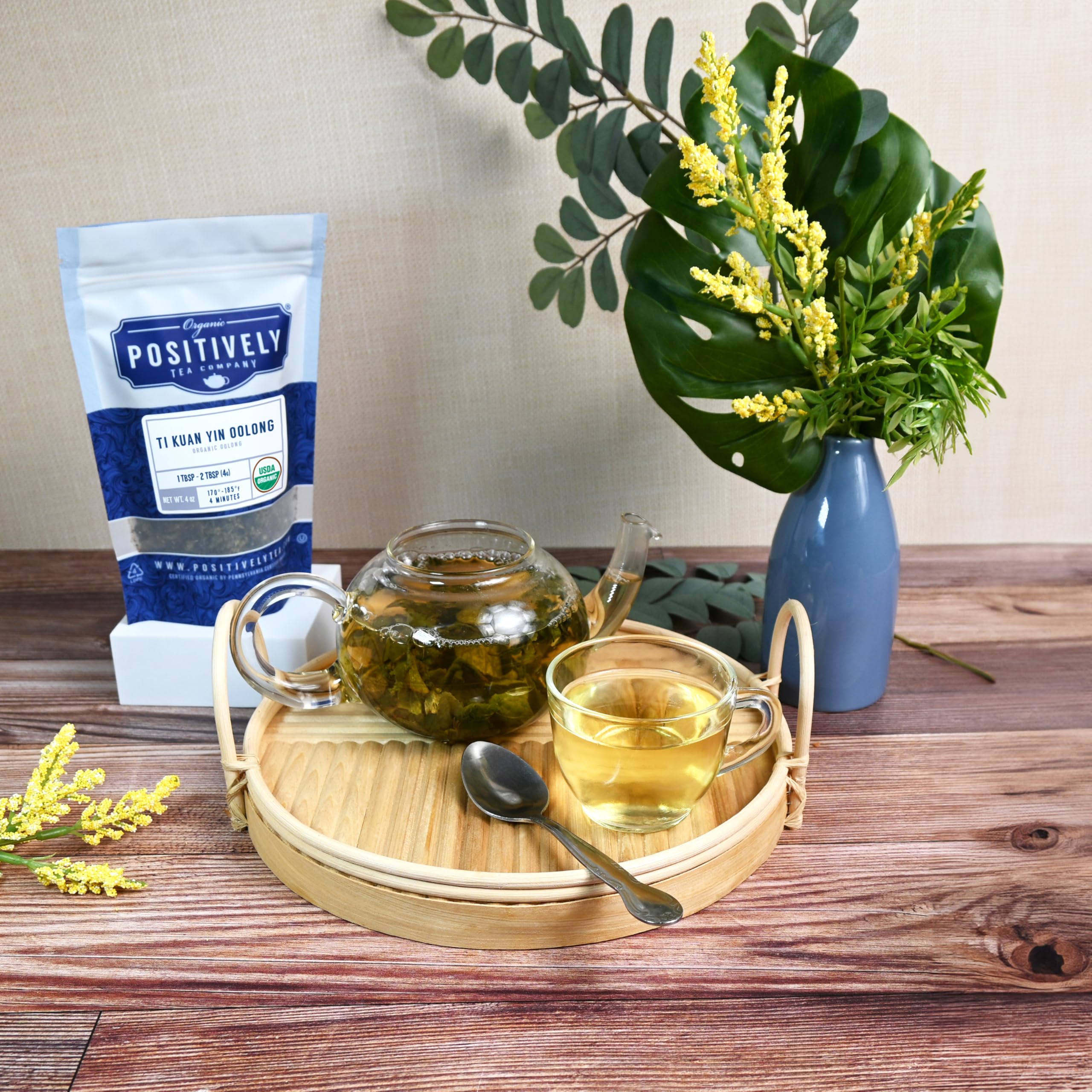 teapot pouring Positively Tea Ti Kuan Yin into cup illustrating serving and steeping clarity