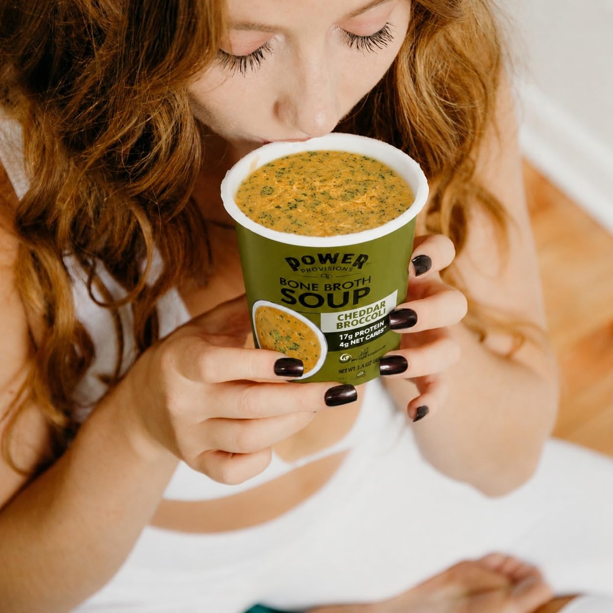 Power Provisions spoon next to cup illustrating serving size and portability