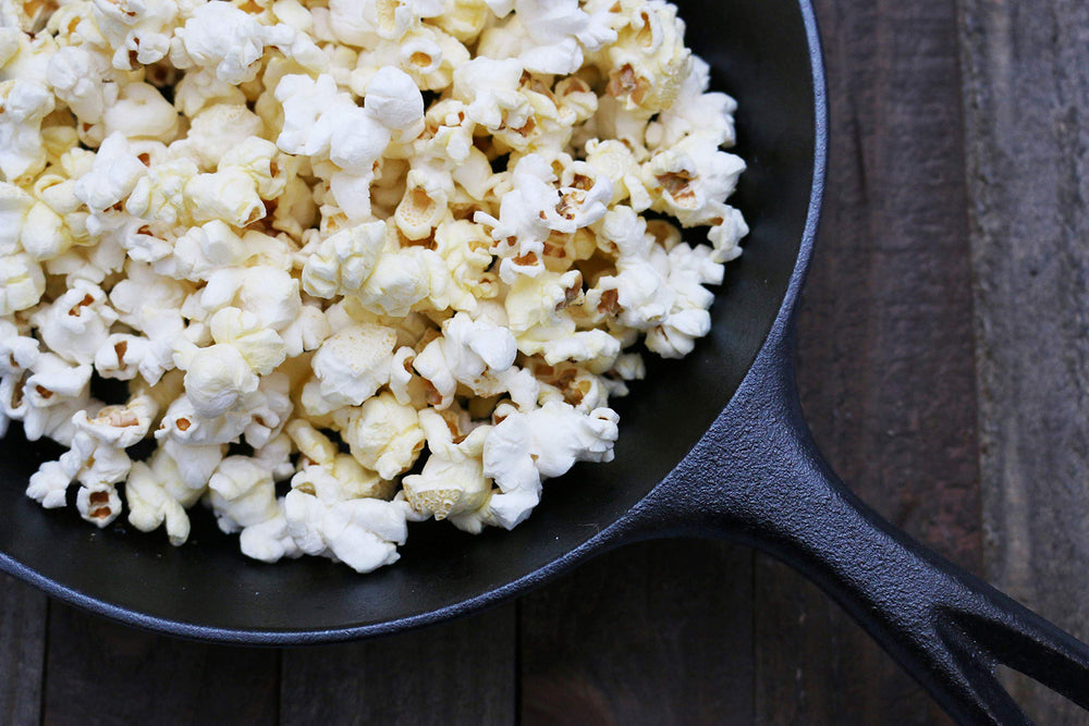 Preferred Popcorn kernel next to a measuring spoon showing portion and yield benefit