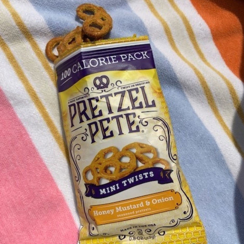 PRETZEL PETE close-up of seasoned mini twist showing soaked-in flavor and crunch