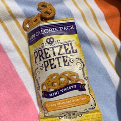 PRETZEL PETE close-up of seasoned mini twist showing soaked-in flavor and crunch