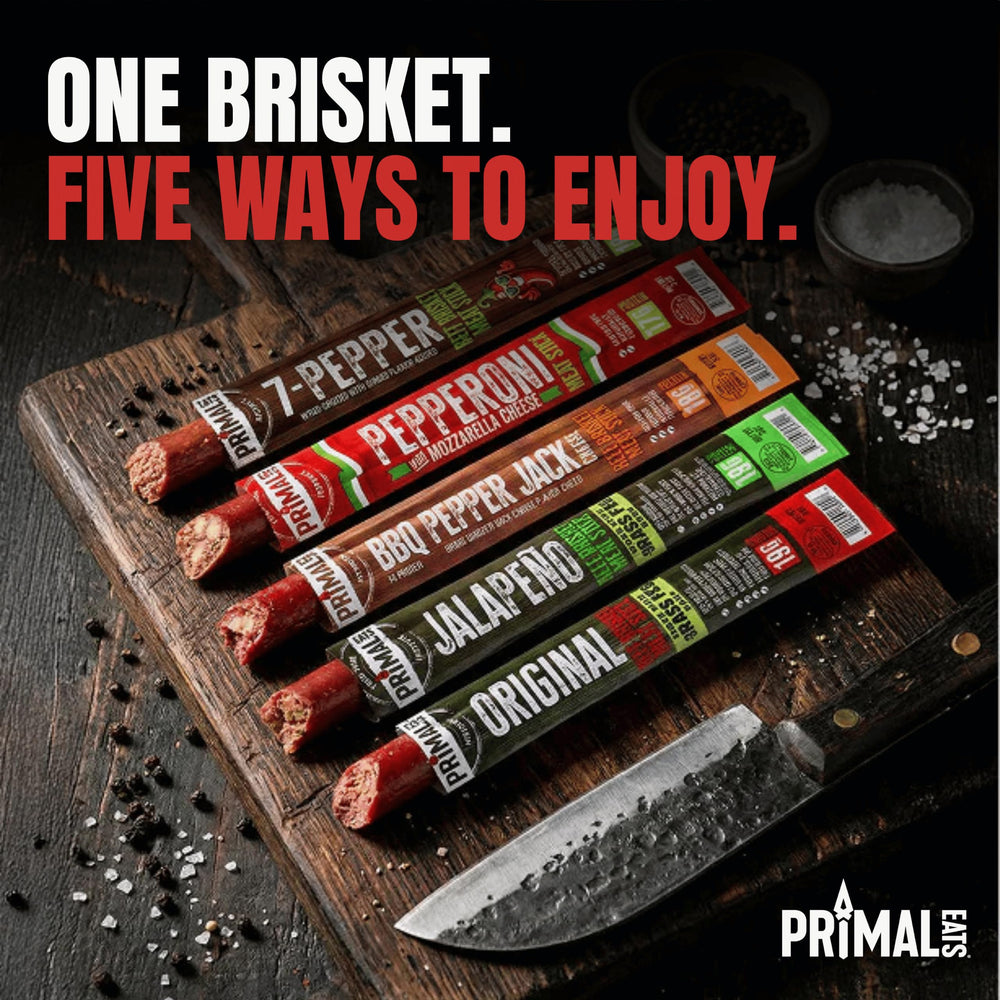 Primal Eats brisket sticks inside a backpack for travel-ready protein