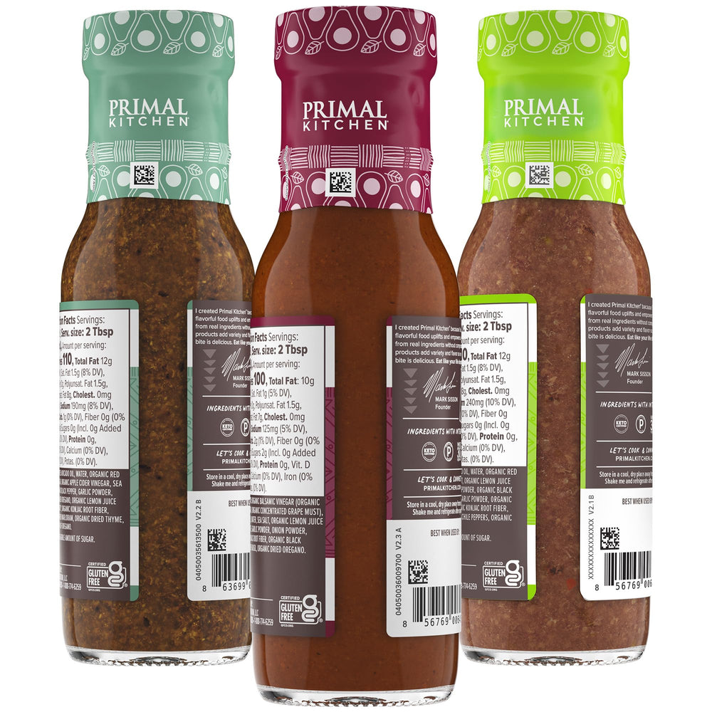 Primal Kitchen Italian Dressing bottle close-up highlighting herb specks and fresh flavor benefit