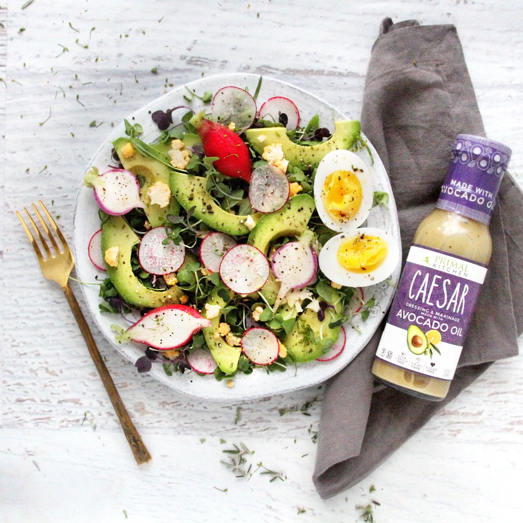 Primal Kitchen kitchen lifestyle serving bowl with dressing enhancing everyday meals