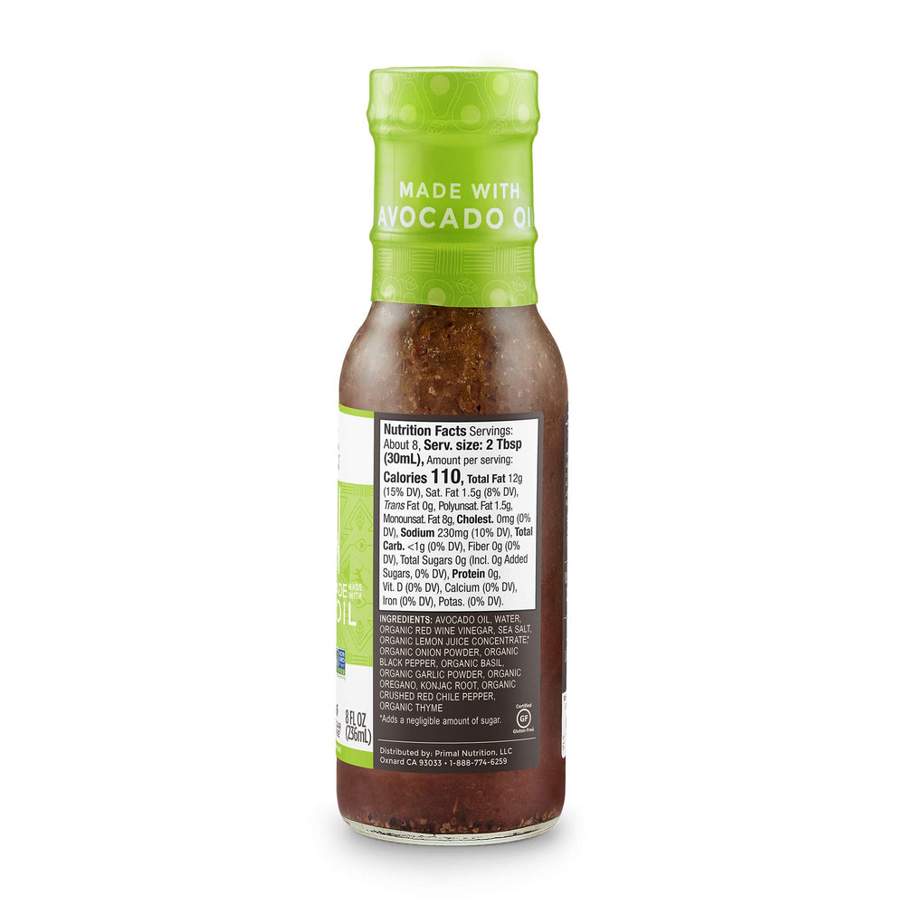 Primal Kitchen bottle beside utensils indicating serving size and meal-ready convenience benefit