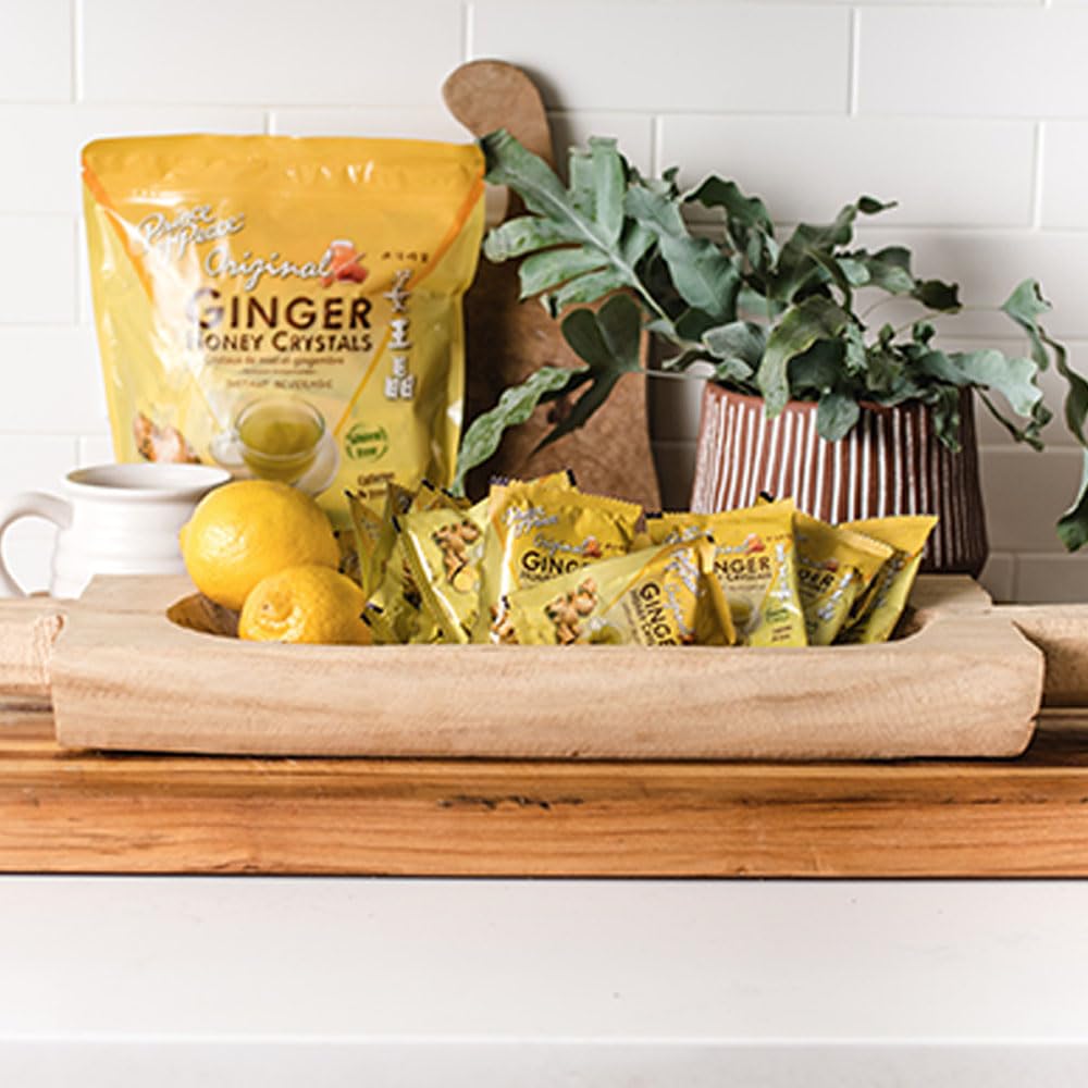 Prince Of Peace sachet beside fresh ginger and honey highlighting ingredients