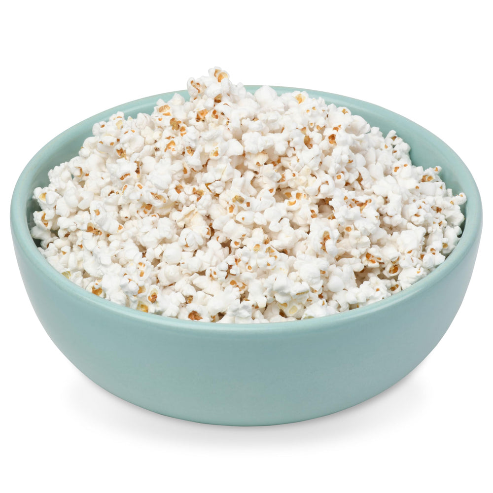 Princeton Popcorn next to measuring cup to show 2 lb bag yield and portion control