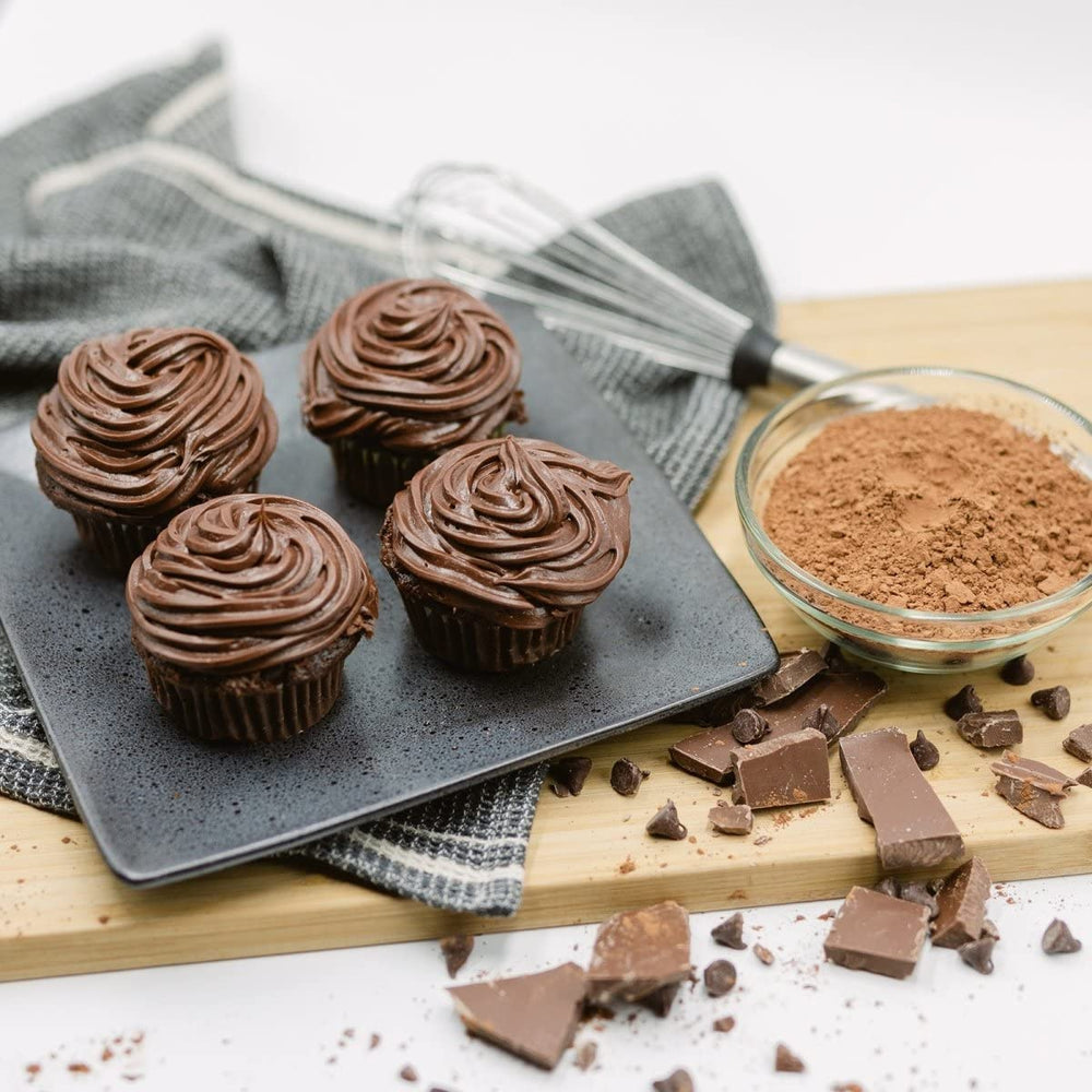 ProDough cupcake in hand showing size and 13g protein per serving