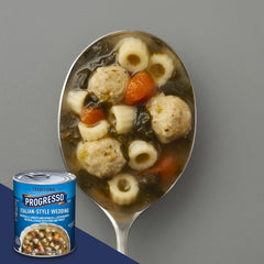 Progresso open can revealing meatballs, spinach and carrots for quick meals
