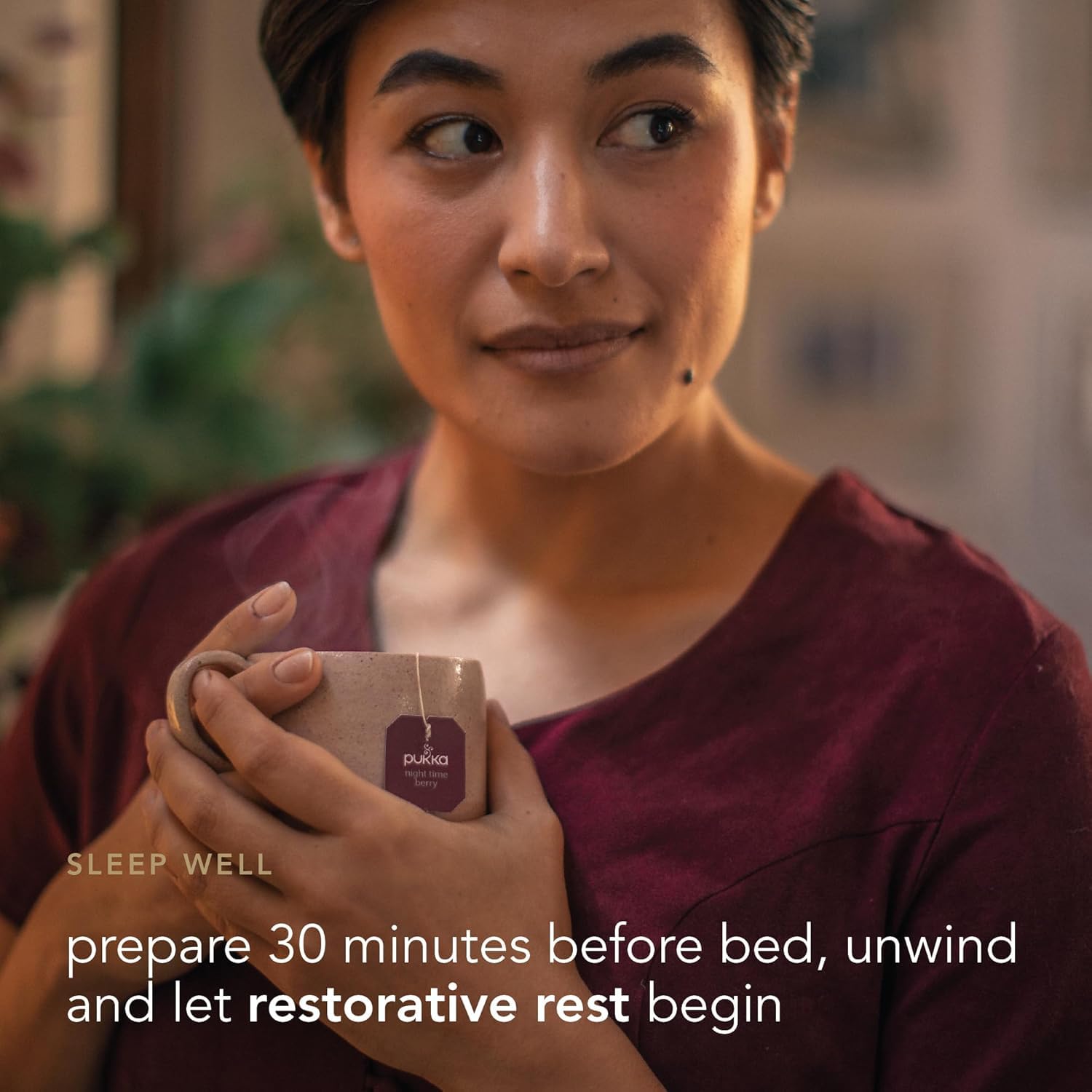Pukka brewed cup with deep berry color demonstrating comforting evening drink