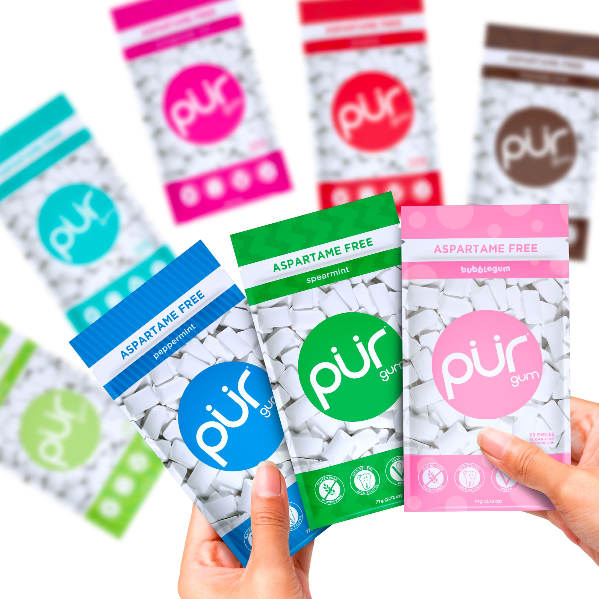 PUR Gum bag in hand for scale showing portability and travel-friendly size