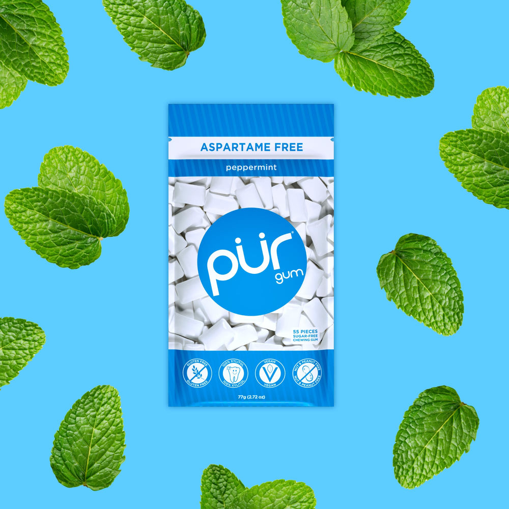 Open resealable PUR Gum bag displaying multiple peppermint pieces for on-the-go freshness