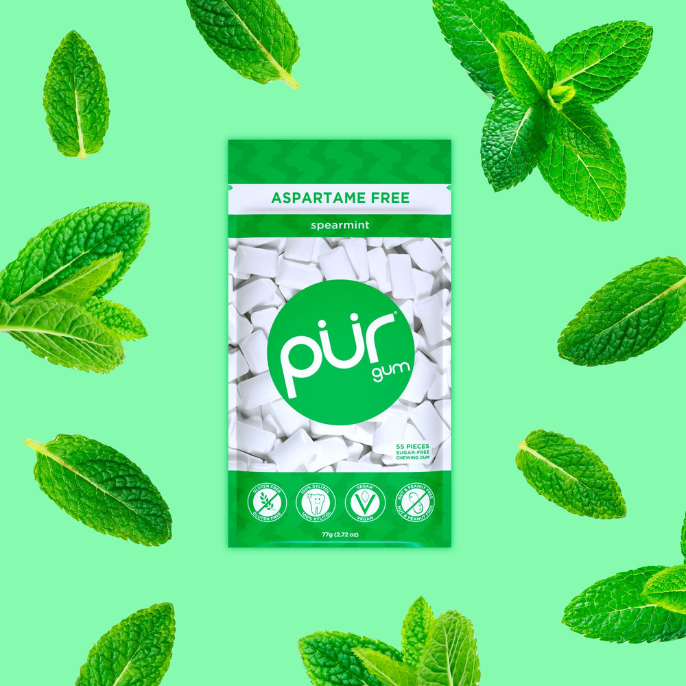 Close-up of a PUR Gum spearmint piece showing smooth texture and consistent chew