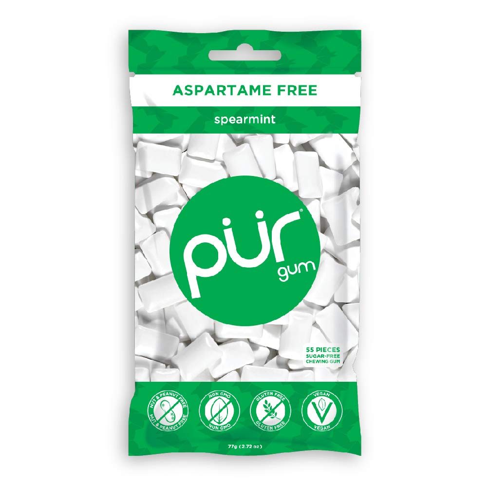 Close-up of single PUR Gum spearmint piece showing smooth texture and fresh flavor