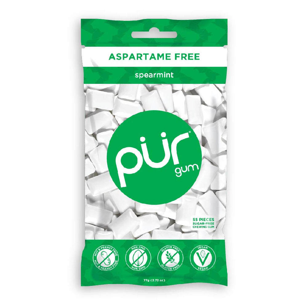 Close-up of single PUR Gum spearmint piece showing smooth texture and fresh flavor